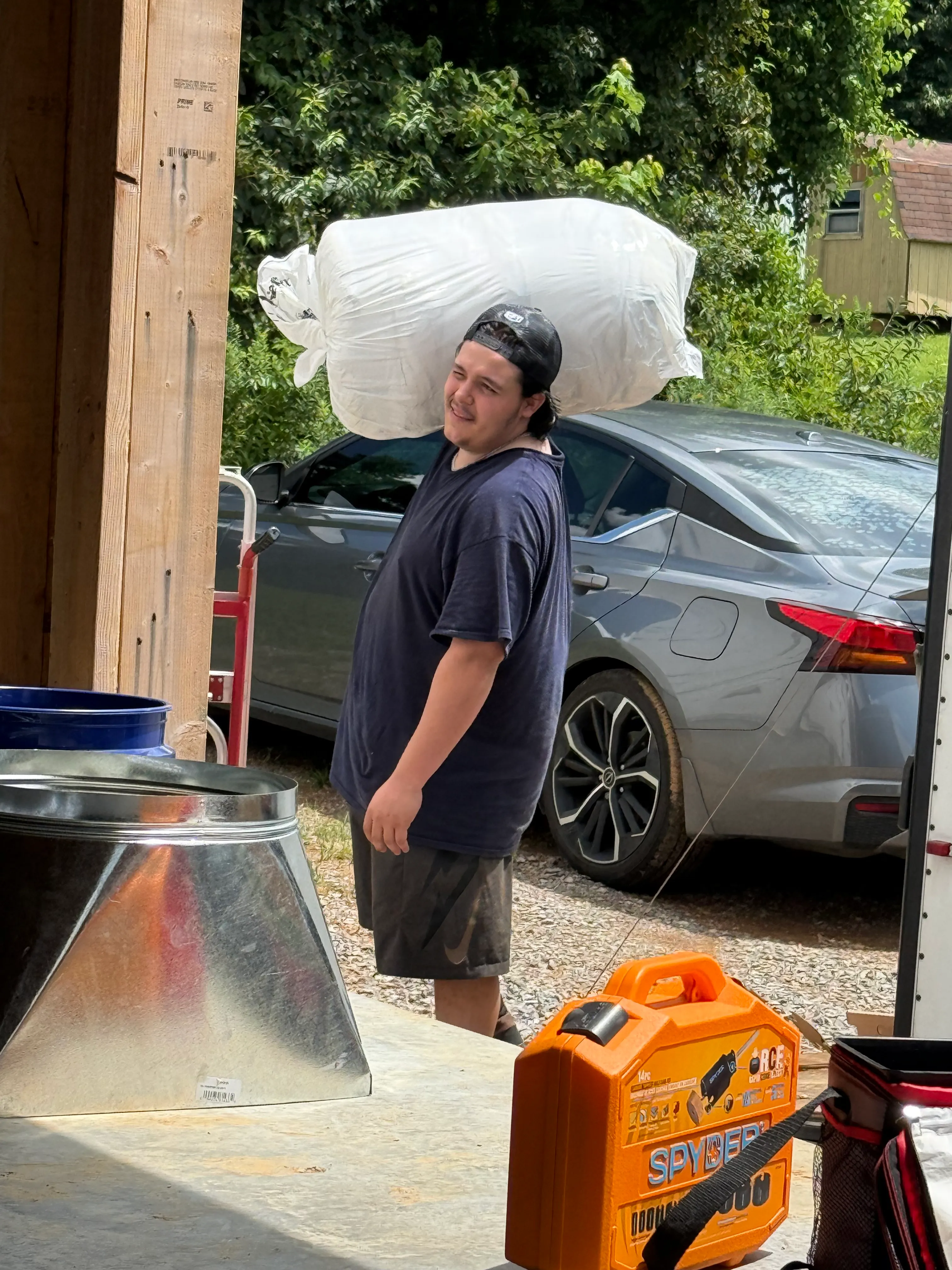 East Tennessee Air Company technician loading HVAC ductwork and supplies for a new construction job in Knoxville, TN