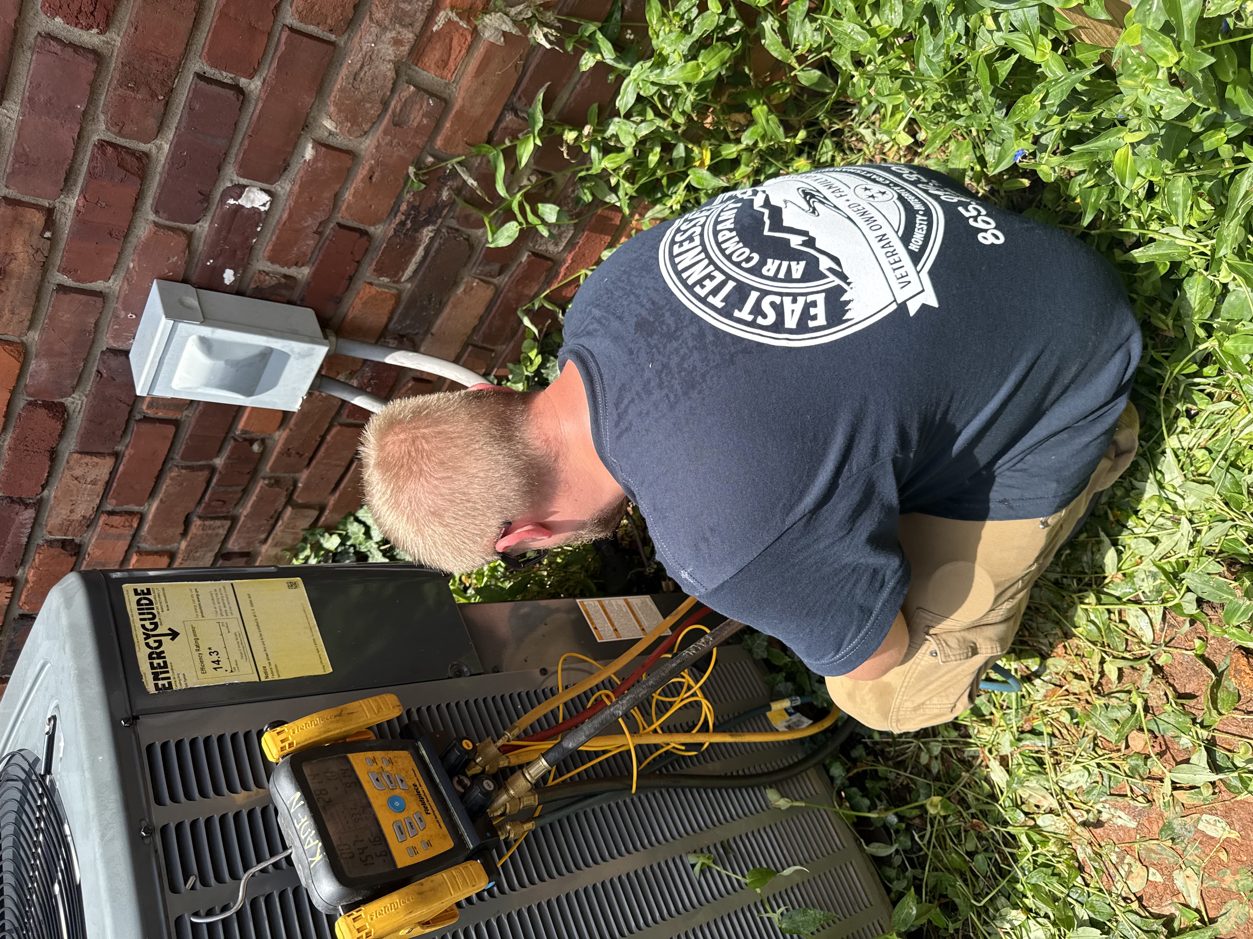 East Tennessee Air Company technician installing new AC system in Knoxville, TN