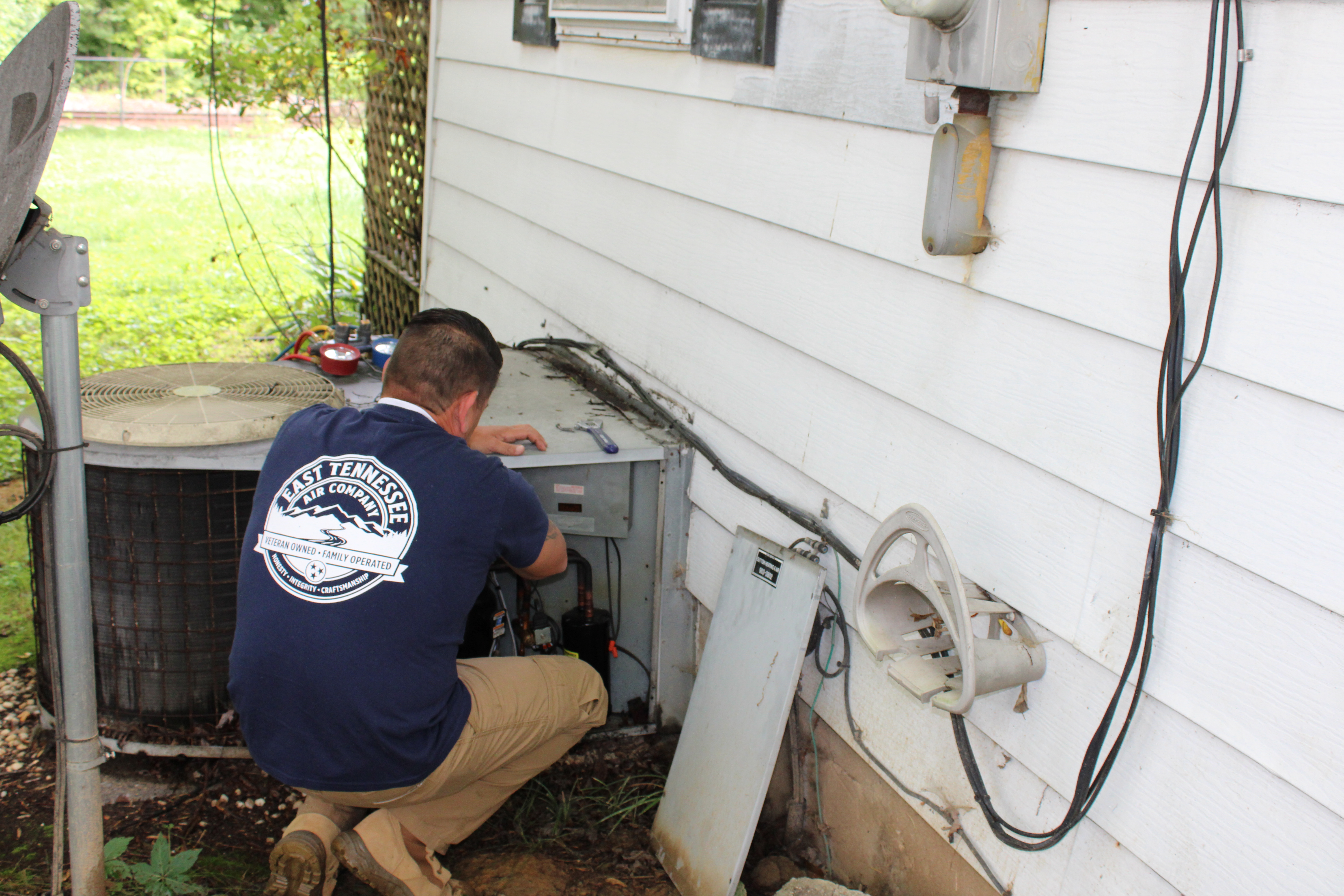 East Tennessee Air Company technician performing HVAC work in Knoxville, TN